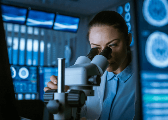 santisphere expert looking through a microscope